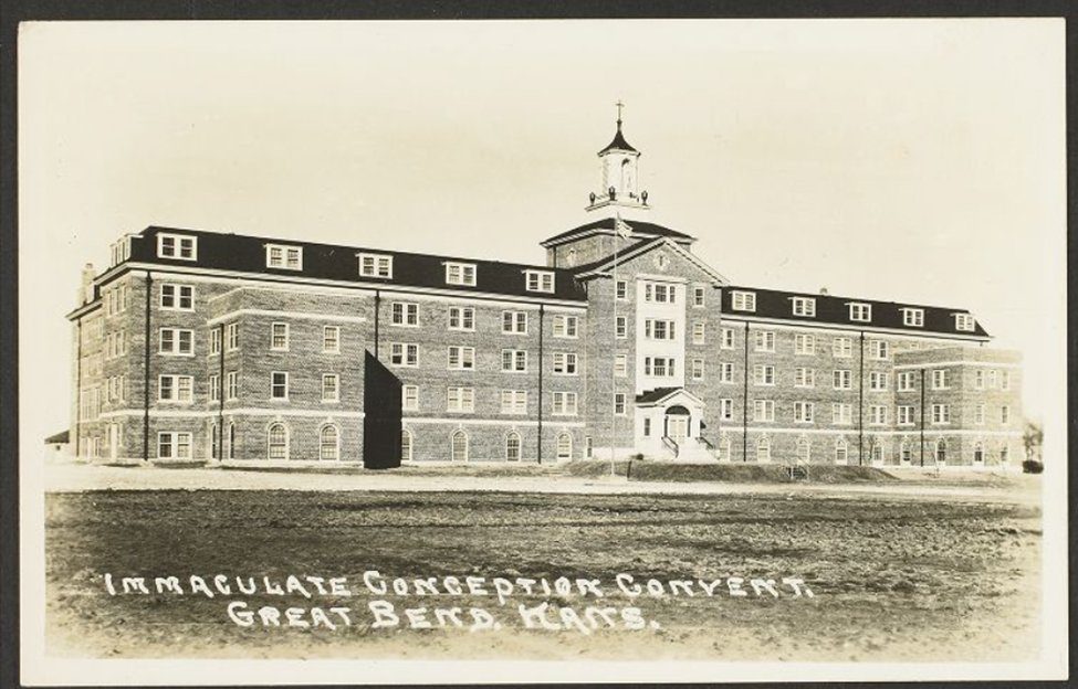 Historic real-photo postcard of the five-story brick building with its cupola, shortly after construction